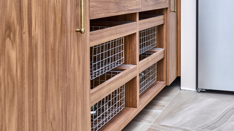 Mesh drawers in a kitchen cabinet