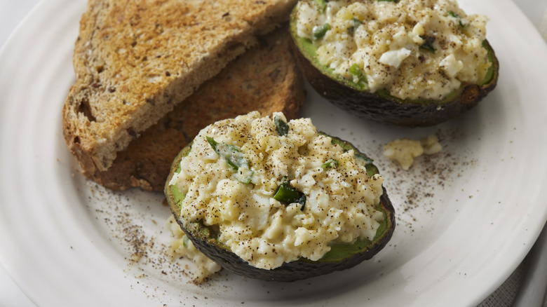 Avocado egg salad and toast on a plate