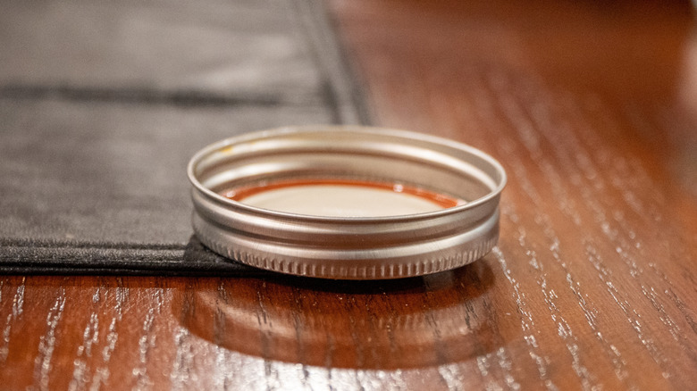 A Mason jar lid on counter