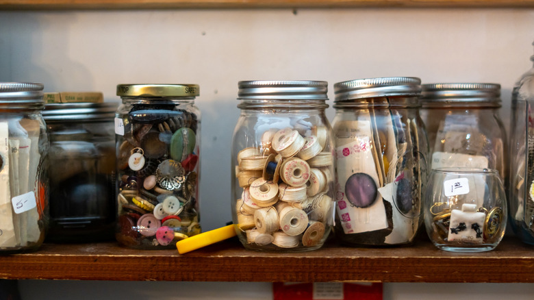 Mason jars filled with crafting items