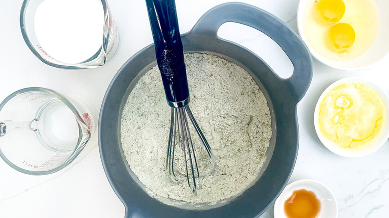 mixing batter with whisk