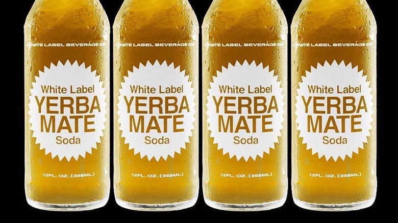 Four bottles of White Label Yerba Mate soda