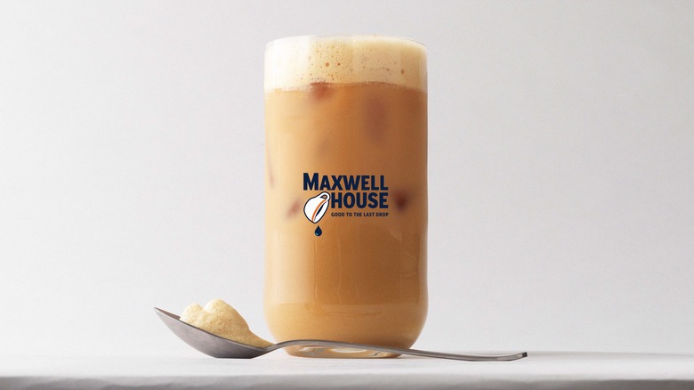 Maxwell House iced latte with foam in glass