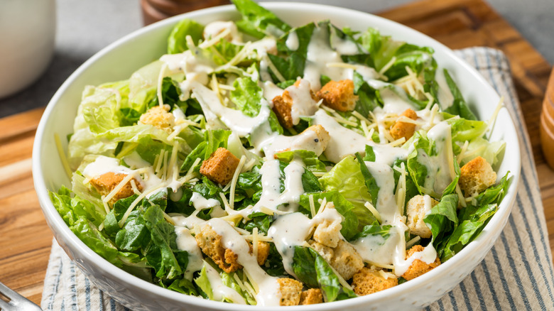 Homemade Caesar salad in a white bowl