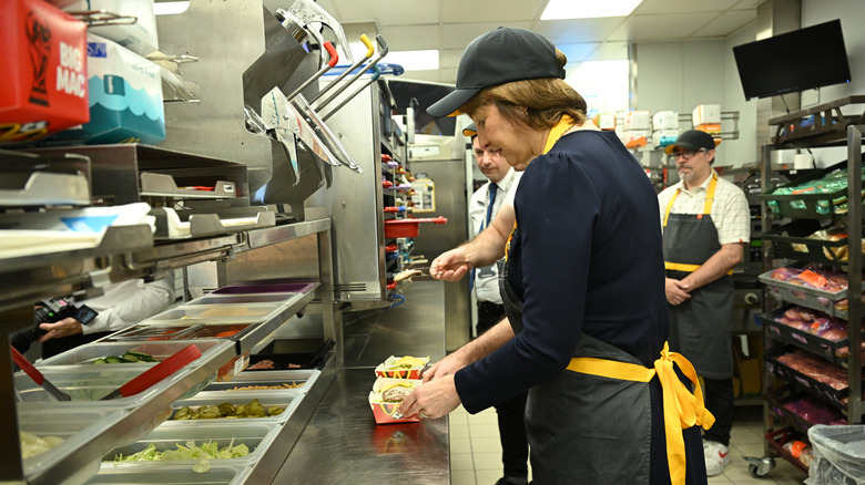 Staff preparing burgers at McDonald's
