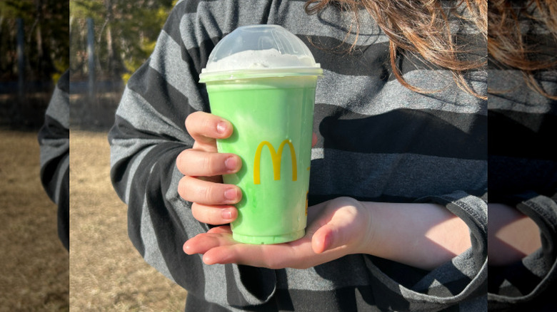 McDonald's Shamrock Shake presented in a person's hands
