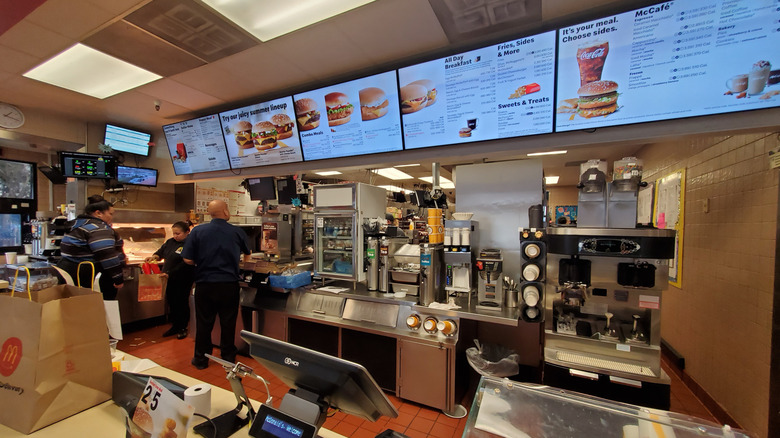 Menus above the kitchen at a McDonald's