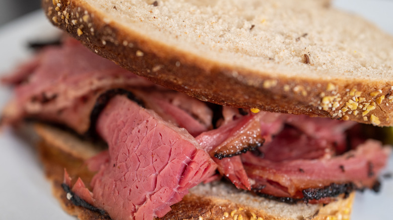 Close up of a pastrami sandwich