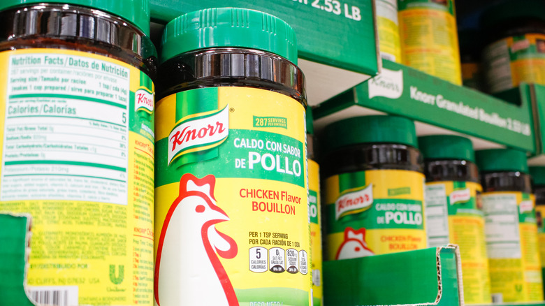 A shelf stocked with jars of Knorr's brand Caldo De Pollo