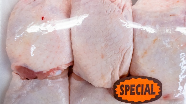 close up of packaged raw chicken