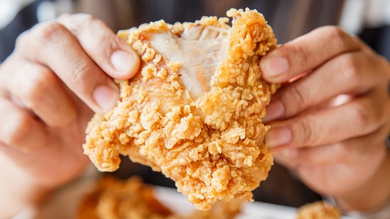 Splitting a piece of fried chicken
