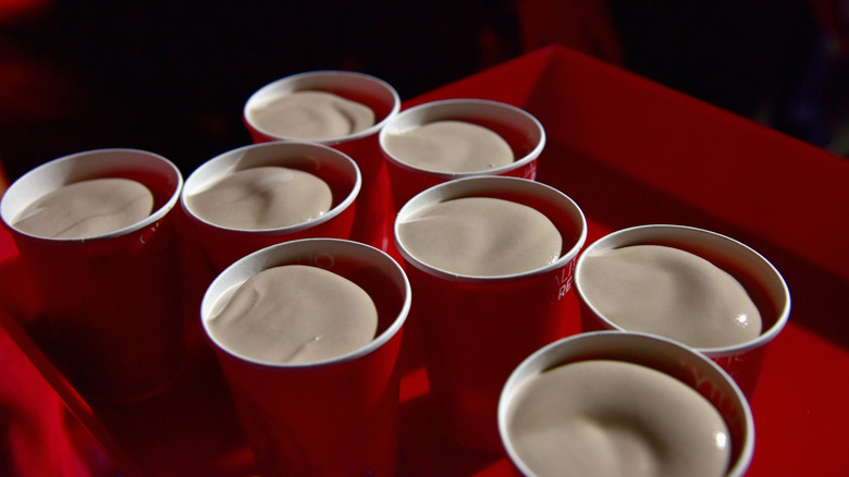A tray full of Wendy's Frosties without lids on the cups.