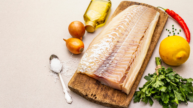 Fish filet on cutting board