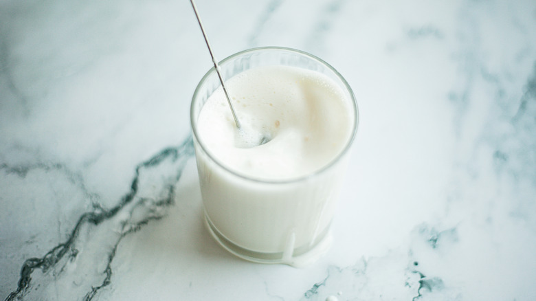 Milk being frothed with a milk frother