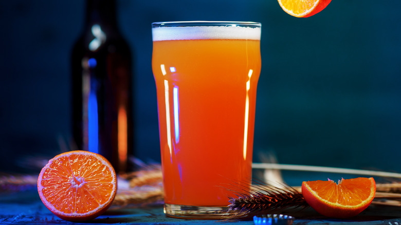 Orange shandy in pint glass 