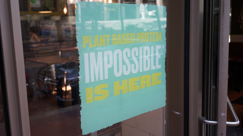 impossible sign on door to qdoba