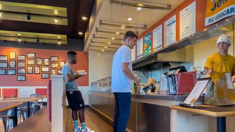 qdoba line inside a restaurant