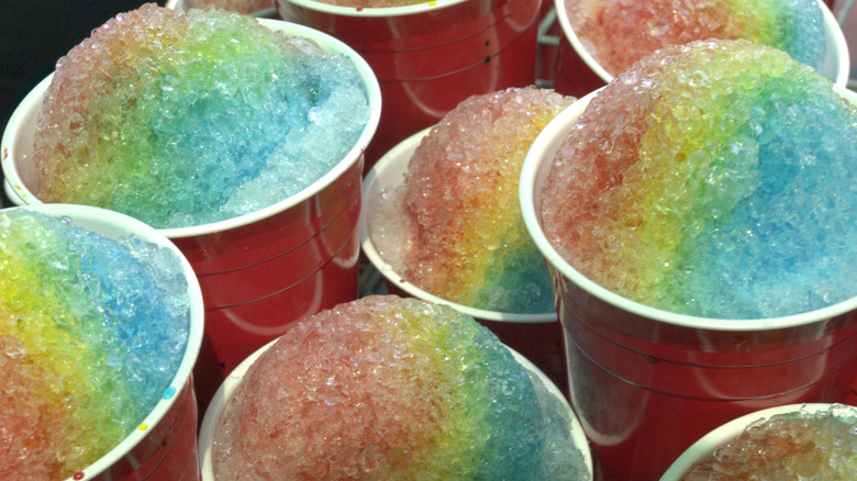 rainbow snow cones in plastic cups