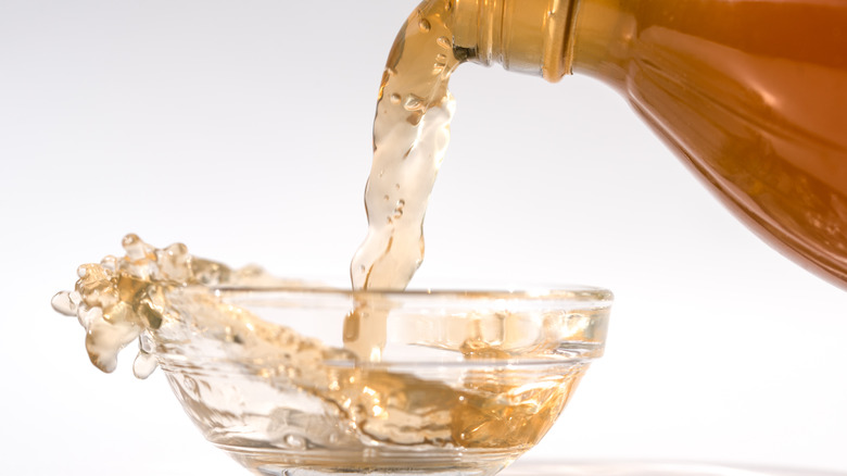 Vinegar being poured into a bowl