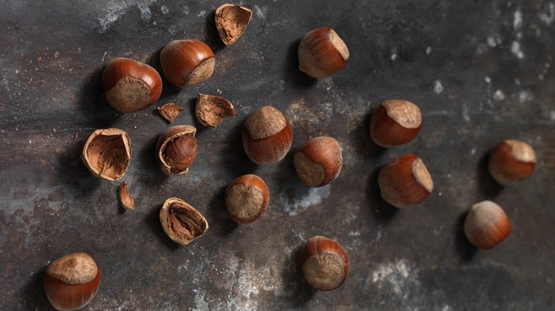 Hazelnuts on black surface