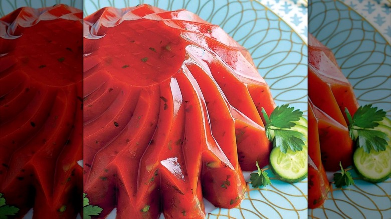 Tomato aspic on a vintage blue plate garnished with parsley