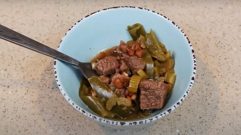 Tepary bean, elk, and vegetable stew in a white bowl