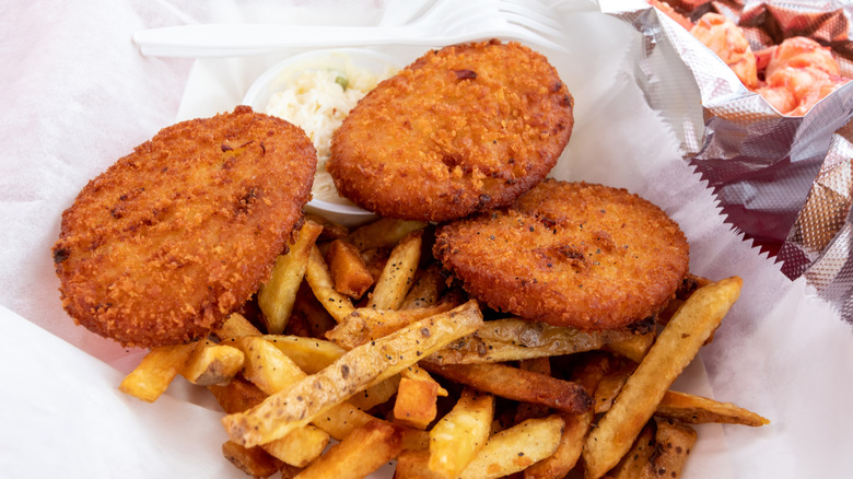 Clam cakes with french fries on white tissue paper