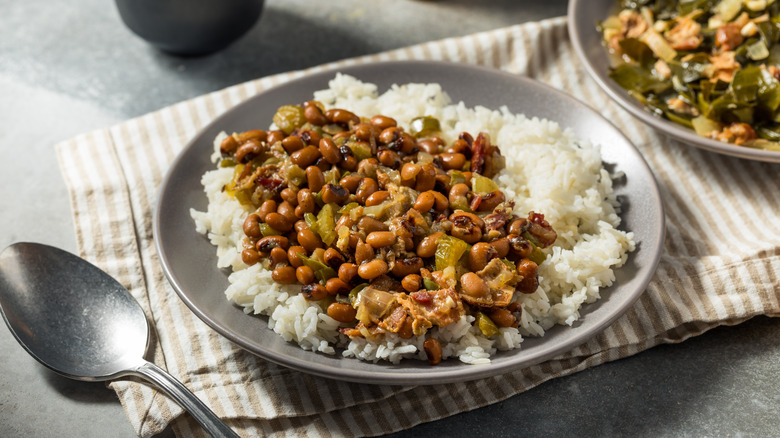 Hoppin' John on a bed of rice on a silver plate