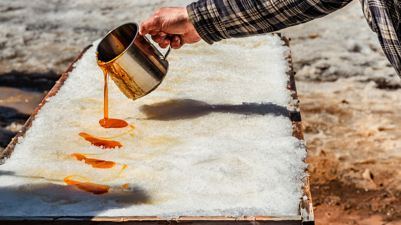 Person making sugar on snow