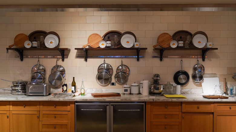 A kitchen display at a Williams Sonoma store featuring numerous pots, pans, and dishes
