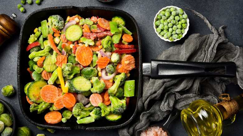 Assorted frozen vegetables in a square cast iron skillet