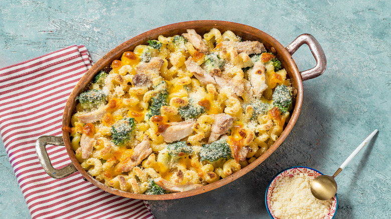 Baked mac and cheese with broccoli in oval baking pan