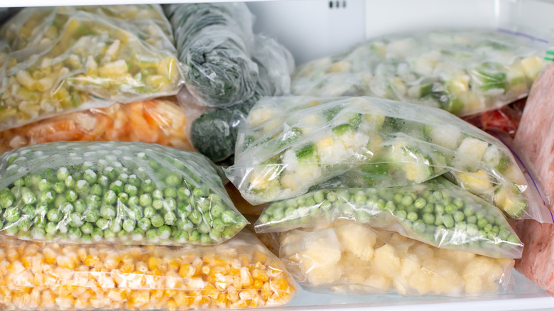 Assorted bags of frozen vegetables in the freezer