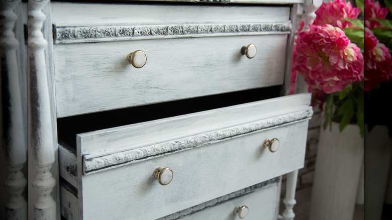 Vintage chest of drawers with pink flowers