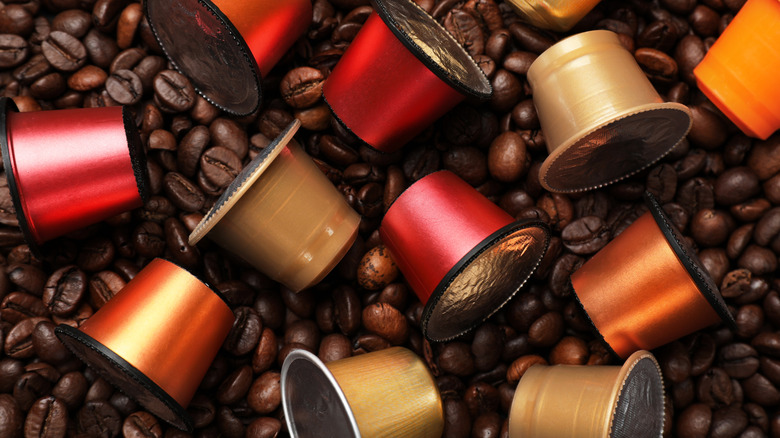 Coffee pods on top of coffee beans