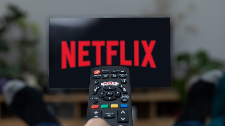 A remote control for a TV with the Netflix logo