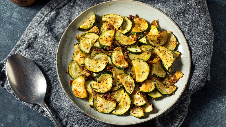 Roasted zucchini moons on plate 