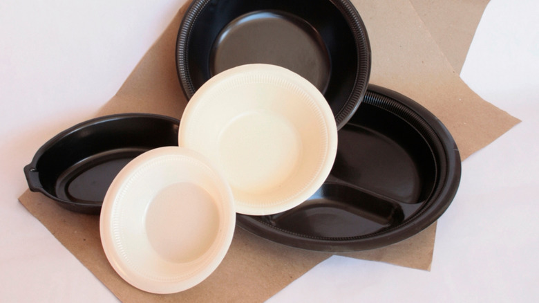 an assortment of black and white food containers