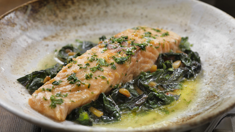 A plate of garlic and lemon poached salmon