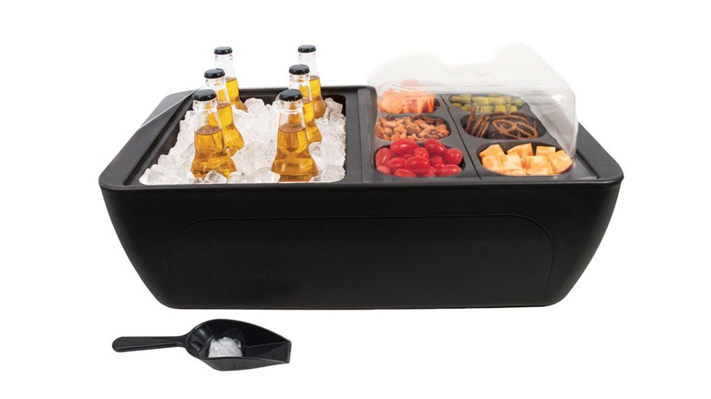 A Crofton Floating Cooler with drinks and snacks on a white background.
