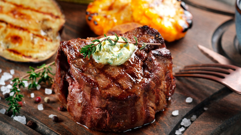 Beef tenderloin pat of butter with fork