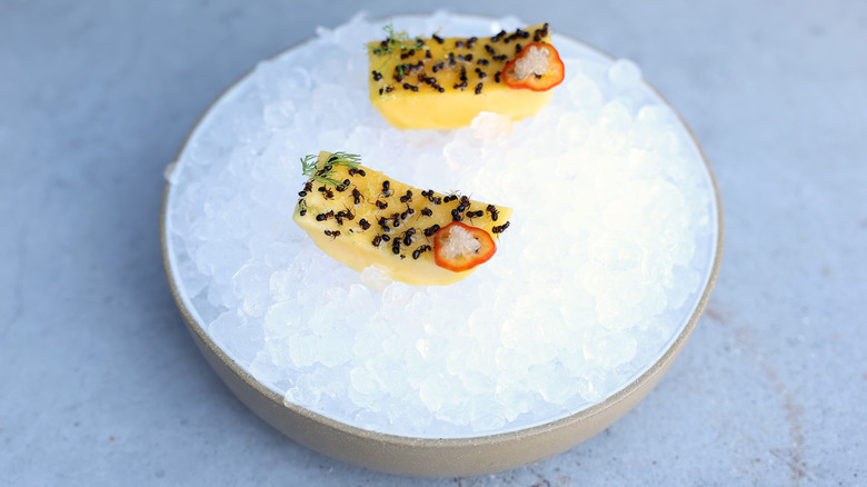 Ants on iced mango dish