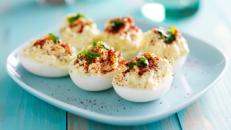 Plate holding six deviled eggs