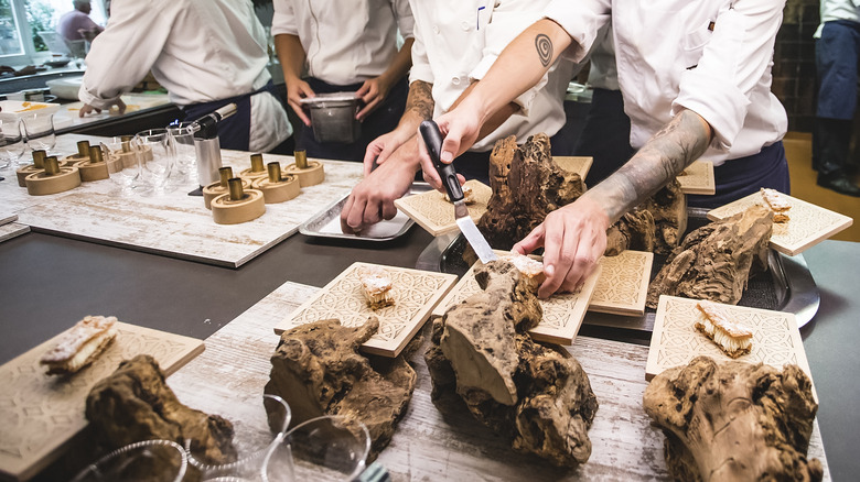 Chefs at Disfruitar prepare a tasting menu