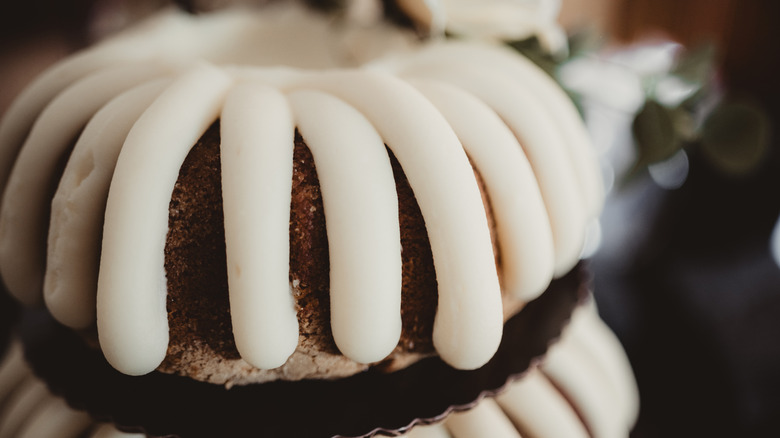 Tiered bundt cake with white frosting