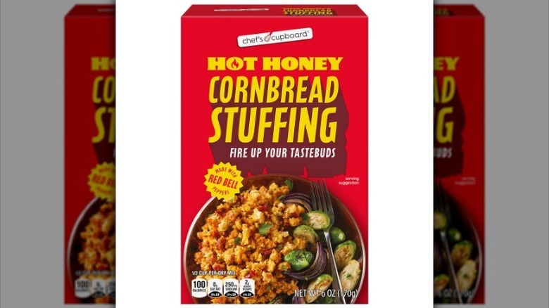 Box of hot honey cornbread stuffing on white background