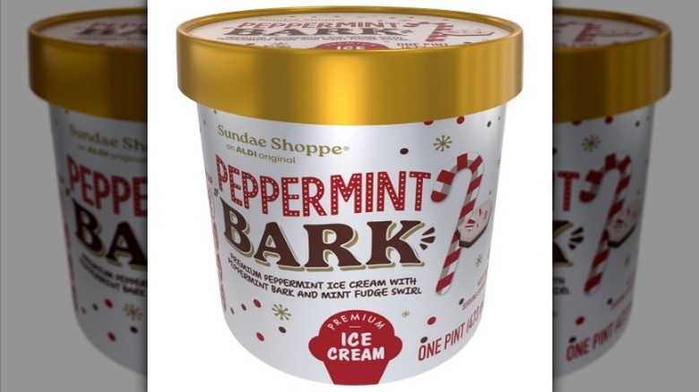 Pint of peppermint bark ice cream on white background