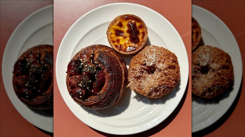 egg tart, mochi donut, and hot dog brioche on a plate