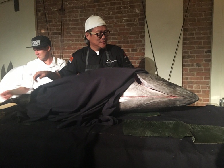Chef Morimoto unveils a giant Japanese tuna at the Rock & Roll sushi event.