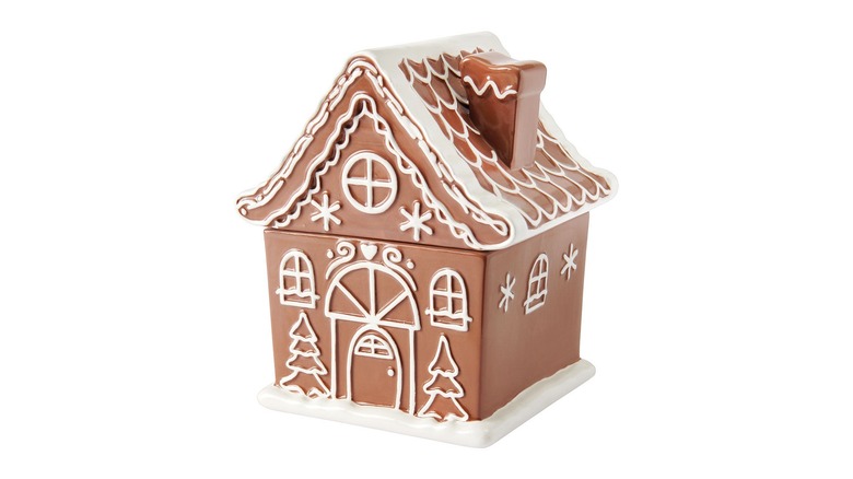 Gingerbread house holiday cookie jar on white background